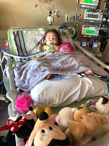 Avery Cunha recovering in her hospital bed at UC Davis Children's Hospital.