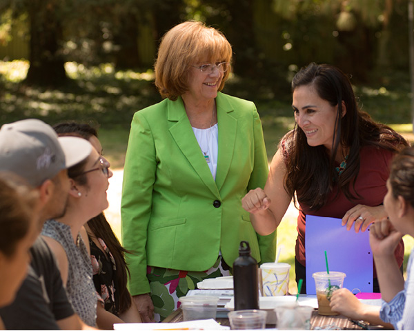 Mary Lou de Leon Siantz, left, and Lisceth Brazil-Cruz prepare a team of UC Davis undergraduate students to collect data for a research project with teen Mexican immigrants in California’s Central Valley. 