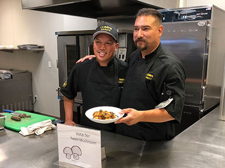 Chefs Jet Aguirre and Santana Diaz in the kitchen